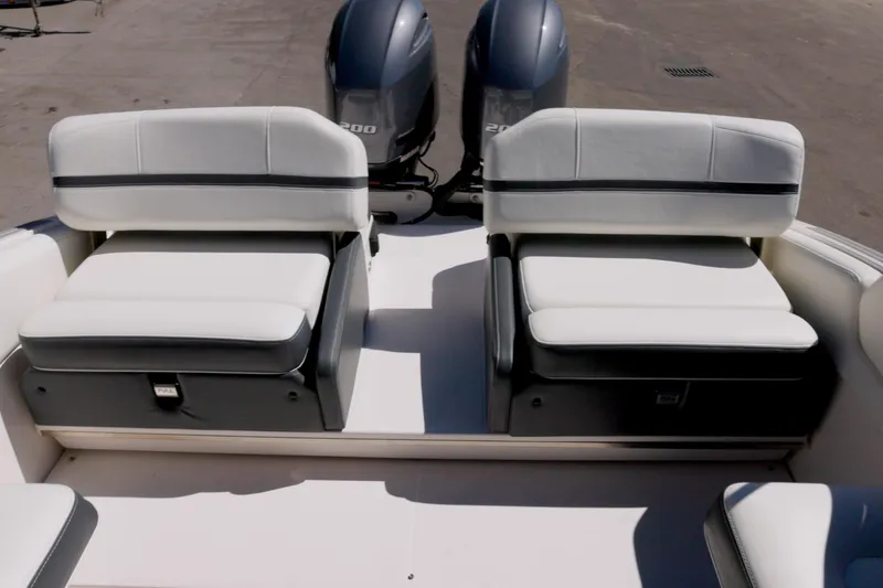Slide: The Image of 2017 Regal 29 OBX boat with dual seating and twin outboard engines. - 13