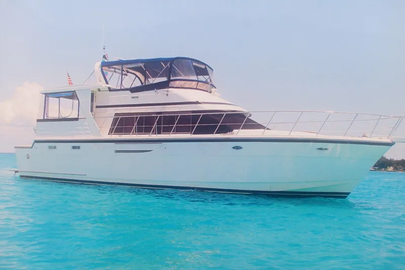 The Image of 1996 Jefferson 52 Rivanna Cockpit MY yacht on clear blue water. - 0