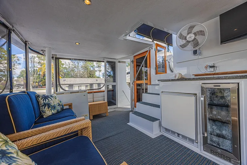 Slide: The Image of Interior of 1996 Jefferson 52 Rivanna Cockpit MY yacht with seating and kitchenette. - 12