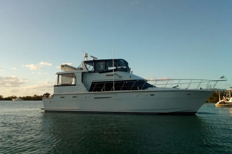 Slide: The Image of 1996 Jefferson 52 Rivanna Cockpit MY yacht on calm water at sunset. - 2