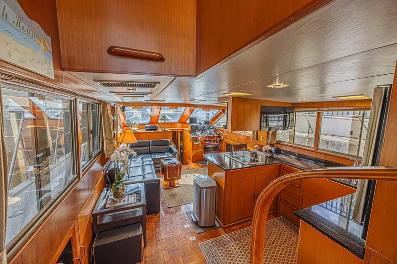 Slide: The Image of Luxurious interior of a 1996 Jefferson 52 Rivanna Cockpit MY yacht with wood finishes. - 35