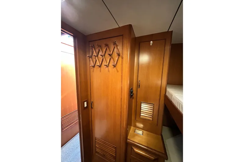 Slide: The Image of Interior of 1996 Jefferson 52 Rivanna Cockpit MY with wooden cabinetry and bunk bed. - 48