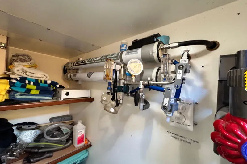 Slide: The Image of Water filtration system in a 1996 Jefferson 52 Rivanna Cockpit MY boat storage area. - 52