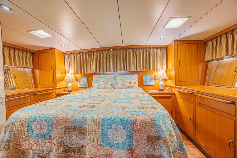 Slide: The Image of Luxurious bedroom interior of 1996 Jefferson 52 Rivanna Cockpit MY yacht, featuring cozy decor. - 60