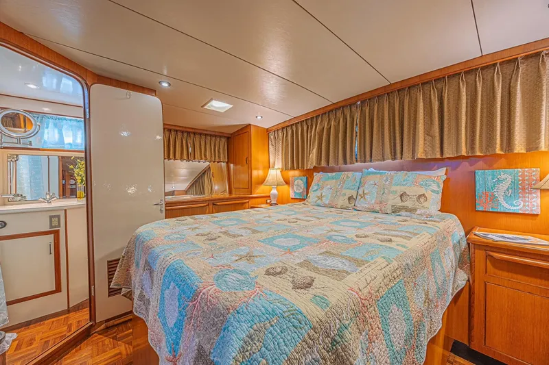 Slide: The Image of Luxurious bedroom interior of 1996 Jefferson 52 Rivanna Cockpit MY yacht with nautical decor. - 61