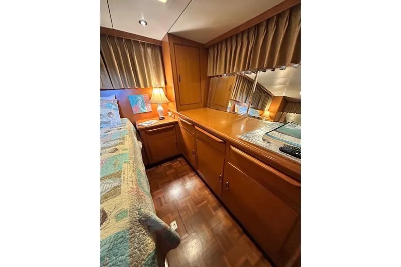 Slide: The Image of Cozy cabin interior of 1996 Jefferson 52 Rivanna Cockpit MY with wood furnishings. - 62