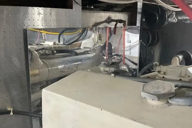 Slide: The Image of Engine room of a 1996 Jefferson 52 Rivanna Cockpit MY yacht, showcasing mechanical components. - 73