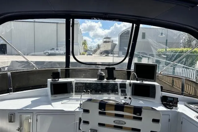 Slide: The Image of Cockpit view of a 1996 Jefferson 52 Rivanna Cockpit MY yacht, featuring navigation equipment. - 21