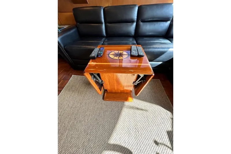 Slide: The Image of Luxurious Jefferson 52 Rivanna Cockpit MY interior with elegant wooden table and leather seating. - 25