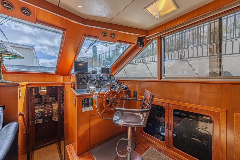 Slide: The Image of Interior of 1996 Jefferson 52 Rivanna Cockpit MY yacht with wooden helm and large windows. - 29