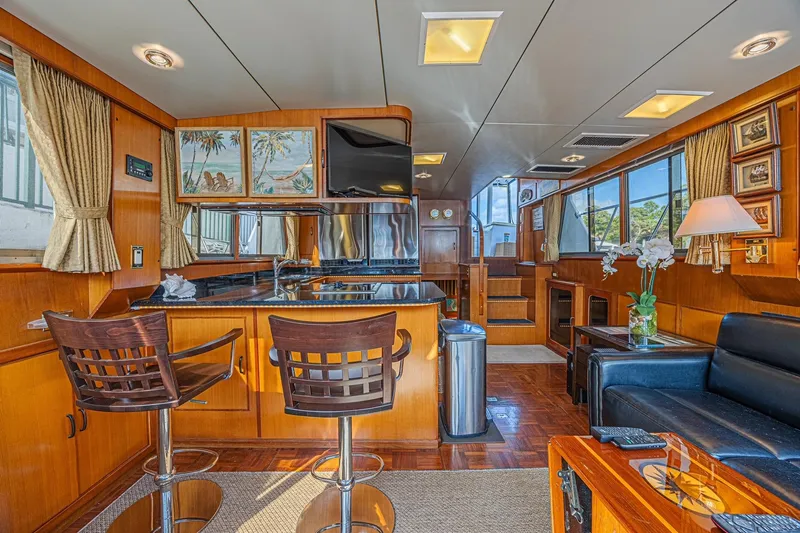 Slide: The Image of Luxurious interior of a 1996 Jefferson 52 Rivanna Cockpit MY yacht with elegant wood finishes. - 32
