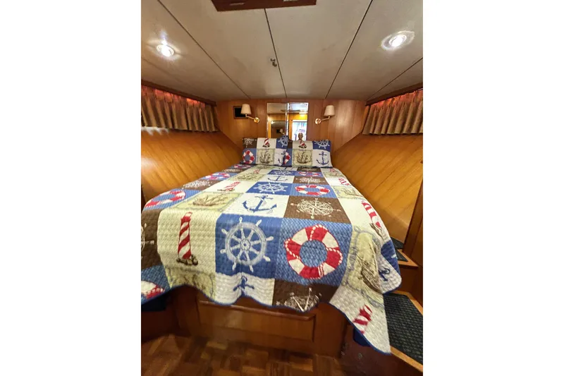 Slide: The Image of Cozy cabin interior of 1996 Jefferson 52 Rivanna Cockpit MY with nautical-themed bedding. - 37