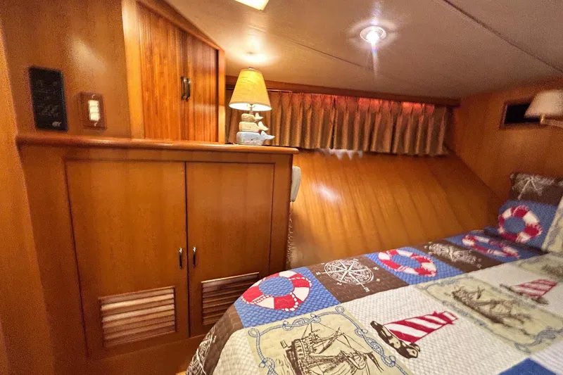 Slide: The Image of Cozy cabin interior of 1996 Jefferson 52 Rivanna Cockpit MY with nautical-themed bedding. - 38