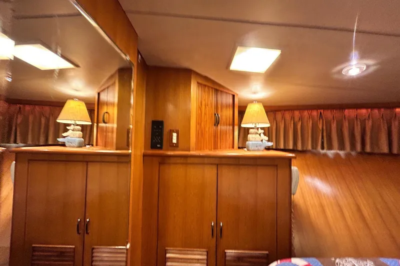 Slide: The Image of Interior of 1996 Jefferson 52 Rivanna Cockpit MY with wooden cabinets and lamps. - 39