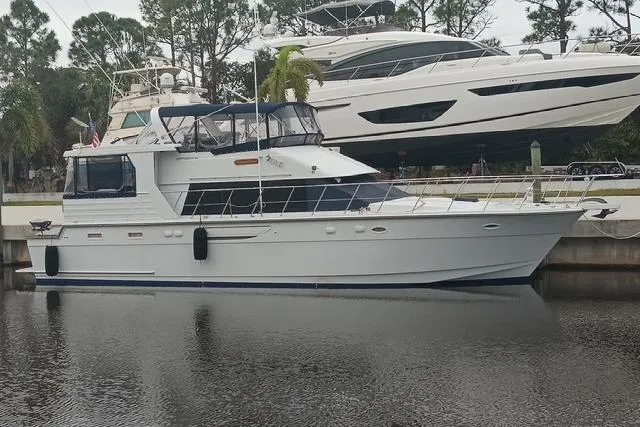 Slide: The Image of 1996 Jefferson 52 Rivanna Cockpit MY yacht docked in a marina, side view. - 4