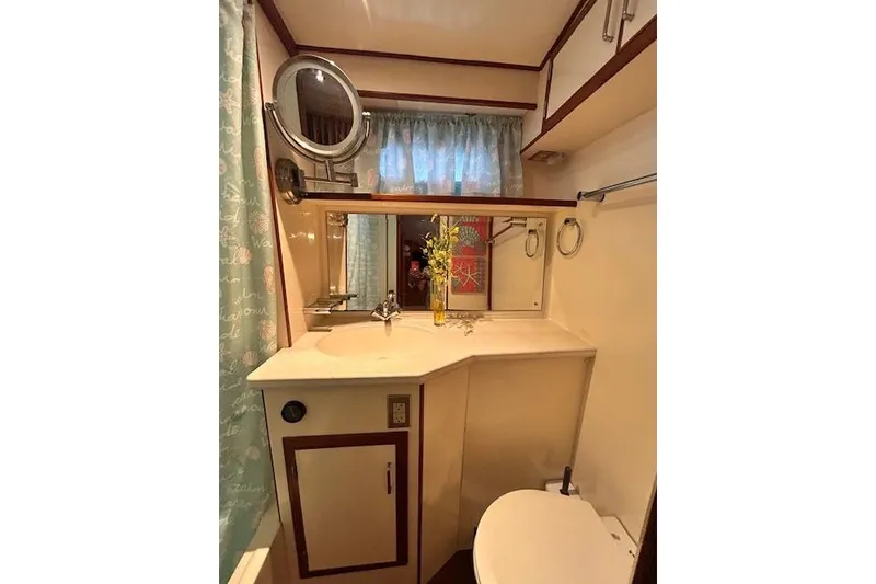 Slide: The Image of Bathroom interior of 1996 Jefferson 52 Rivanna Cockpit MY yacht, featuring sink and mirror. - 43