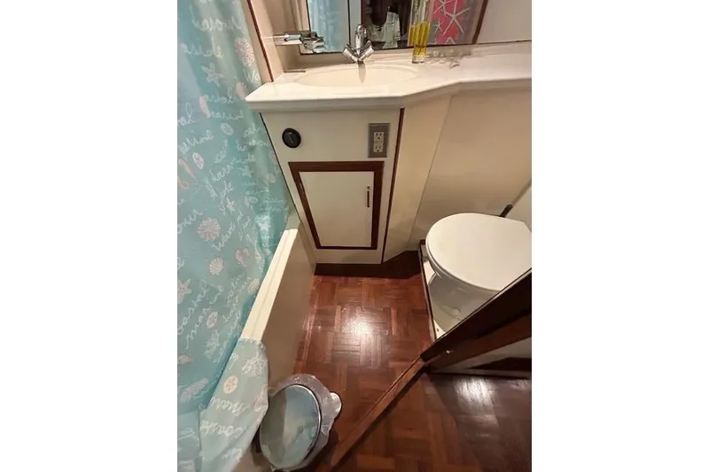 Slide: The Image of Bathroom interior of 1996 Jefferson 52 Rivanna Cockpit MY yacht, featuring sink and toilet. - 44