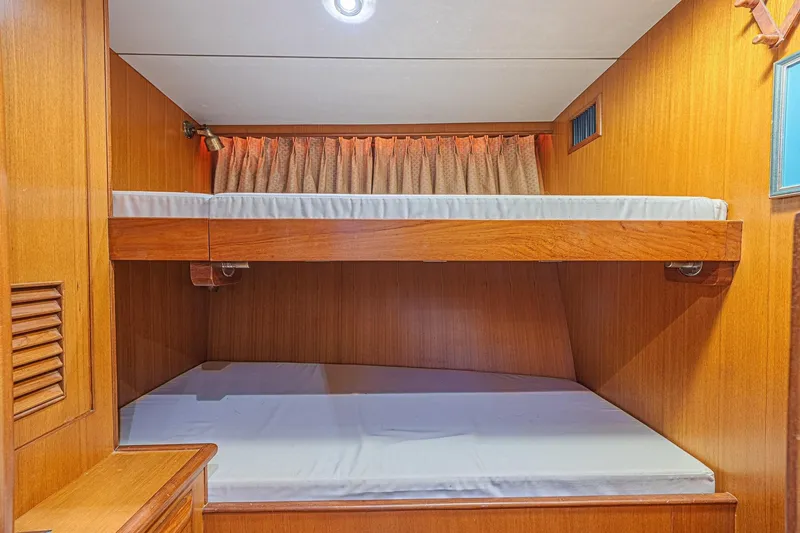 Slide: The Image of Interior of 1996 Jefferson 52 Rivanna Cockpit MY with wooden bunk beds. - 45