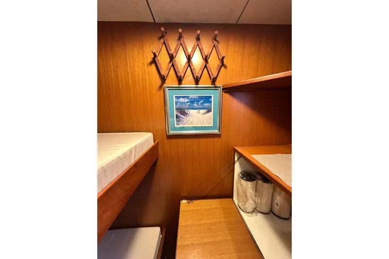 Slide: The Image of Interior of 1996 Jefferson 52 Rivanna Cockpit MY with wooden paneling and bunk beds. - 46