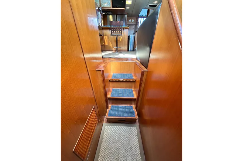 Slide: The Image of Interior stairs of 1996 Jefferson 52 Rivanna Cockpit MY yacht, featuring wooden finish. - 49
