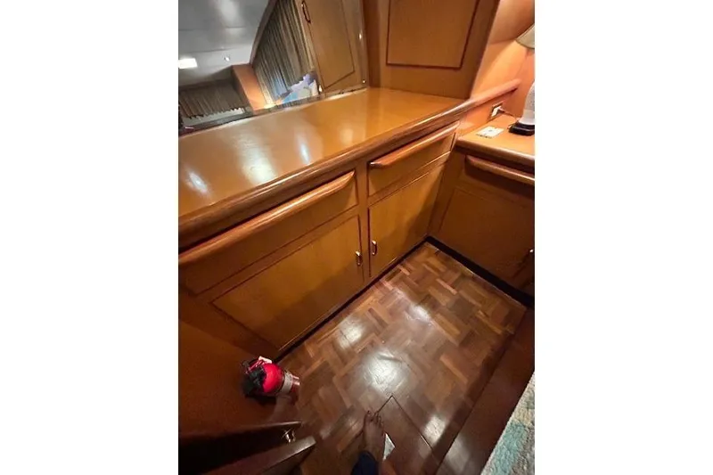 Slide: The Image of Interior of 1996 Jefferson 52 Rivanna Cockpit MY with wooden cabinetry and flooring. - 58