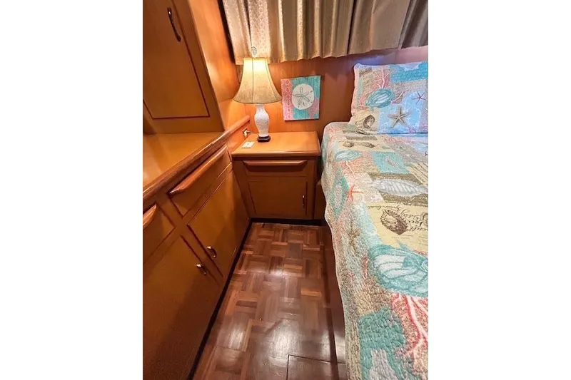 Slide: The Image of Cozy cabin interior of 1996 Jefferson 52 Rivanna Cockpit MY with nautical-themed bedding. - 59