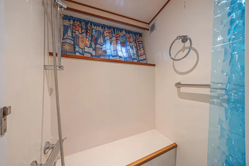 Slide: The Image of Bathroom interior of 1996 Jefferson 52 Rivanna Cockpit MY with nautical-themed curtains. - 67