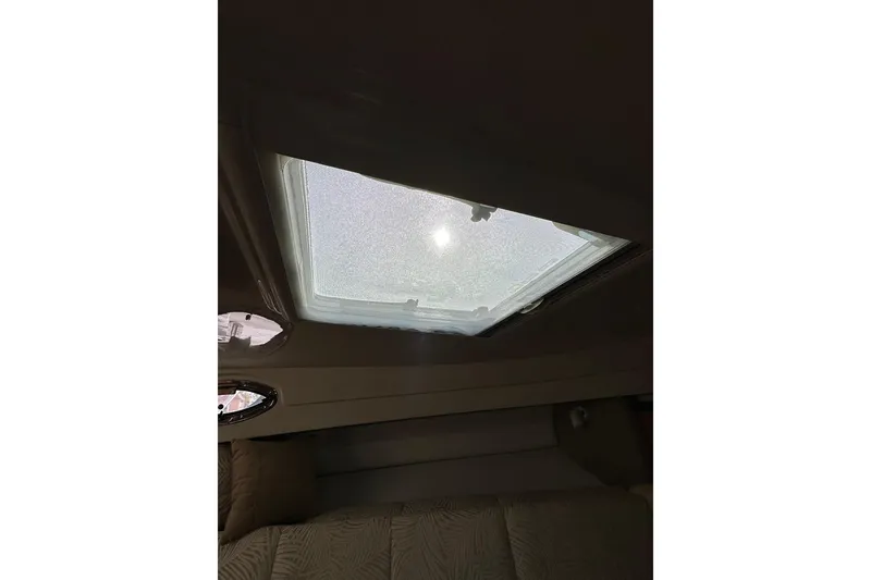 Slide: The Image of 2007 Robalo R305 Walkaround cabin interior with skylight view. - 37