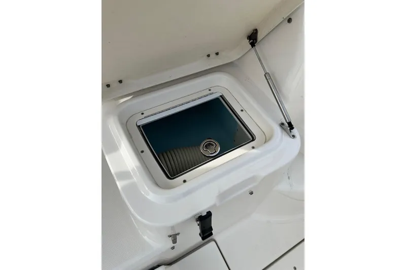 Slide: The Image of 2007 Robalo R305 Walkaround boat storage compartment with hydraulic lift. - 41