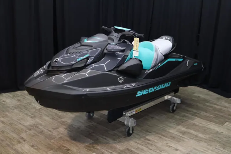 Slide: The Image of 2026 Sea-Doo GTR 230 jet ski in black and turquoise. - 2
