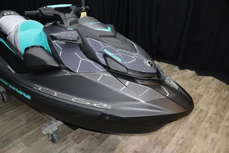 Slide: The Image of 2026 Sea-Doo GTR 230 jet ski with sleek design on wooden floor. - 8
