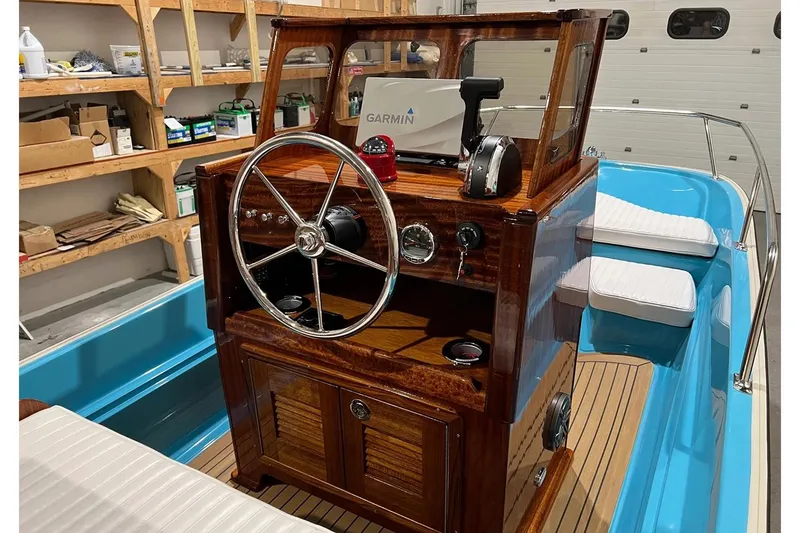 Slide: The Image of Manufacturer Provided Image: Elegant 2026 Metan Manhasset 17 boat interior with wooden helm and modern navigation equipment. - 3