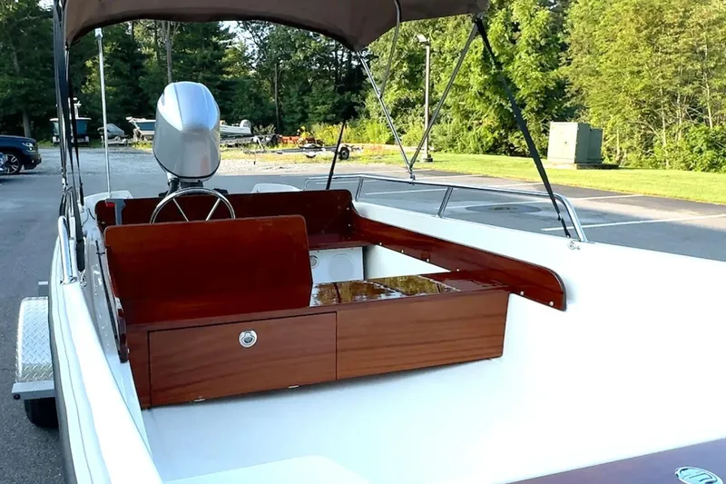 Slide: The Image of Manufacturer Provided Image: 2026 Metan Super Sport 17 boat interior with wooden accents and steering wheel. - 3