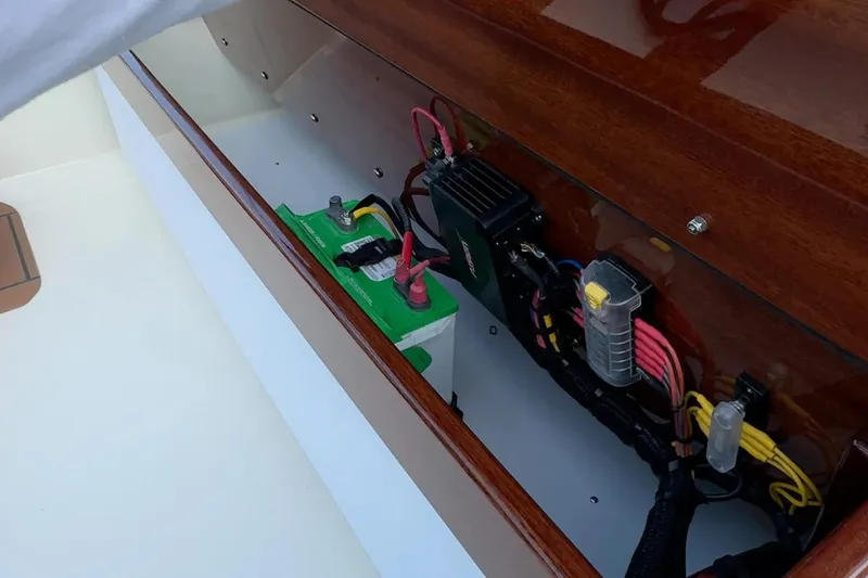 Slide: The Image of Manufacturer Provided Image: Electrical components inside Metan Super Sport 17 boat, 2026 model, featuring battery and wiring. - 5