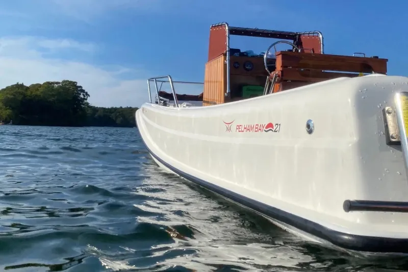 Slide: The Image of Manufacturer Provided Image: 2026 Metan Pelham Bay 21 Heritage Edition boat on water, sunny day. - 4