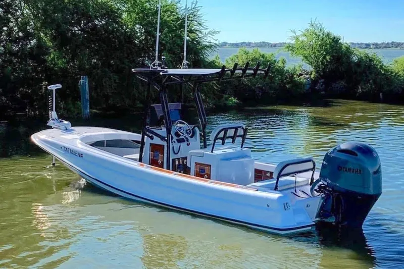 Slide: The Image of Manufacturer Provided Image: 2026 Metan Pelham Bay 21 Sport Fish Edition boat on calm water, featuring Yamaha outboard motor. - 3