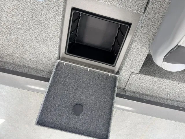 Slide: The Image of Yamaha Boats 2026 storage compartment with carpeted lid and open hatch. - 16