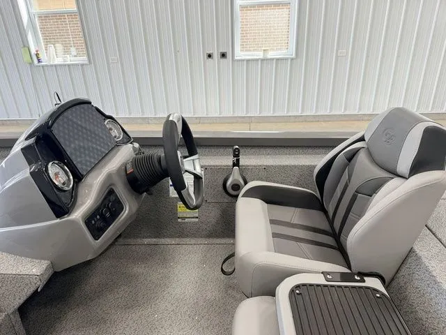 Slide: The Image of Interior of a 2026 Yamaha Boats model with steering wheel and seat. - 17