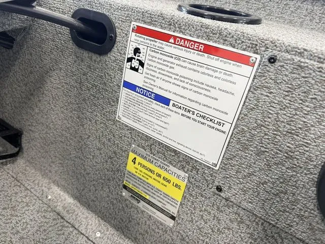 Slide: The Image of Warning labels and capacity information on Yamaha Boat 2026 model. - 21