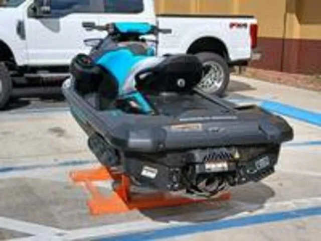 Slide: The Image of 2026 Sea-Doo GTR 230 jet ski parked beside white truck. - 4
