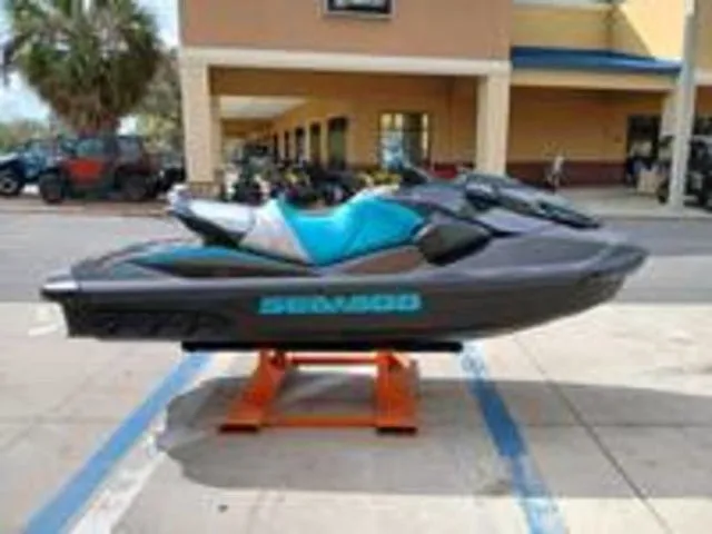 Slide: The Image of 2026 Sea-Doo GTR 230 jet ski displayed in a parking lot. - 7