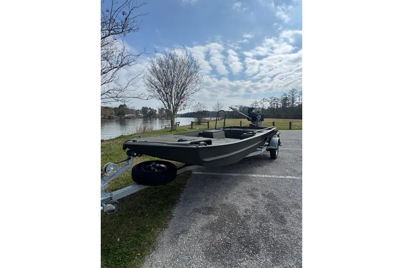 Slide: The Image of 2026 Go-Devil 18×60 Surface Drive Mud Boat on trailer by a lake. - 5