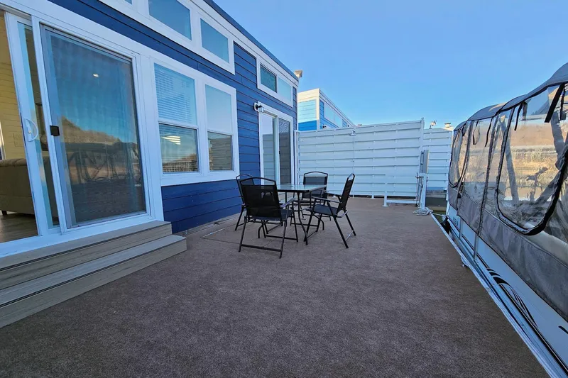 Slide: The Image of Modern 2025 houseboat float house with outdoor seating on deck. - 5