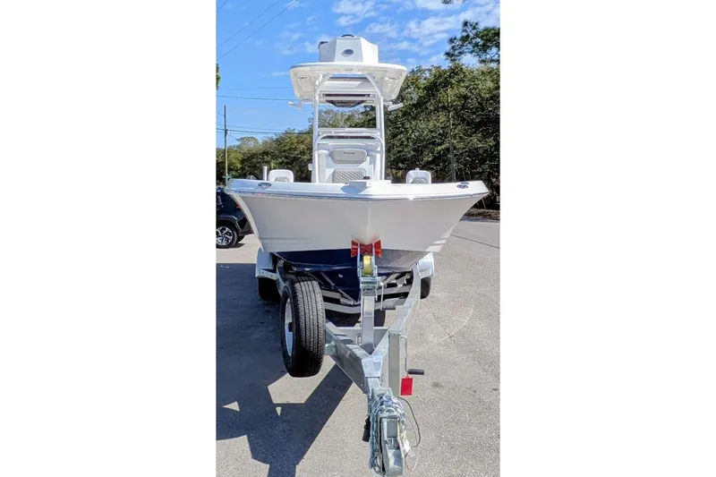 Slide: The Image of 2026 Caymas 281 HB boat with dual Mercury engines on a trailer. - 4