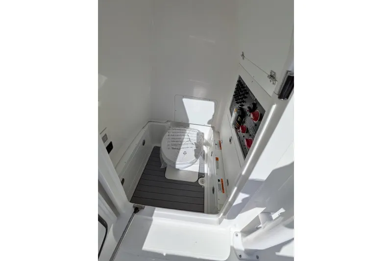 Slide: The Image of 2026 Caymas 281 HB boat seats with quilted cushions and storage compartments. - 9