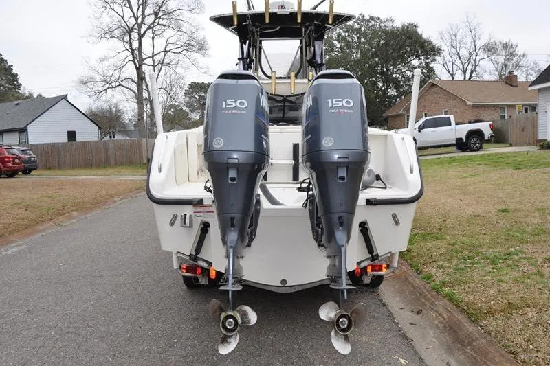 Slide: The Image of 2006 Pursuit 2570 Center Console boat with dual 150 horsepower outboard motors. - 23