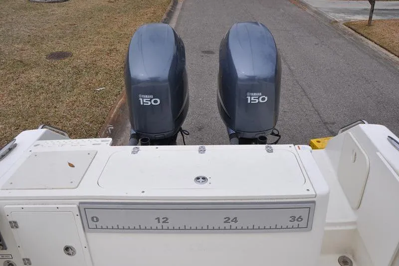 Slide: The Image of 2006 Pursuit 2570 Center Console with dual Yamaha 150 engines, rear view. - 31