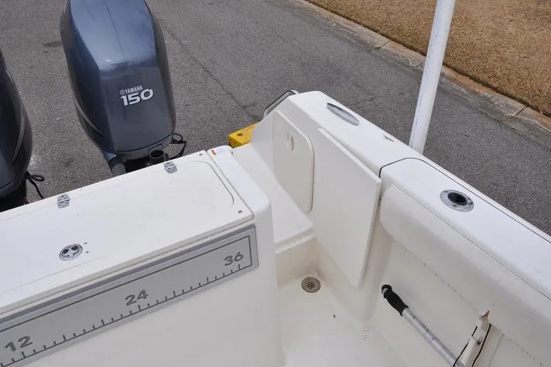 Slide: The Image of 2006 Pursuit 2570 Center Console boat with Yamaha 150 engines, featuring a spacious deck layout. - 33