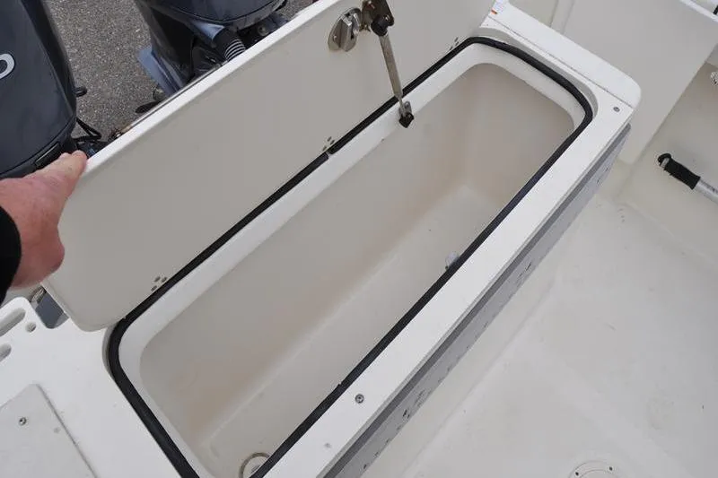 Slide: The Image of Open storage compartment on 2006 Pursuit 2570 Center Console boat. - 35