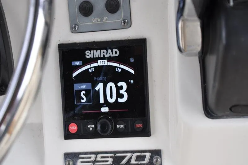 Slide: The Image of Simrad navigation display on 2006 Pursuit 2570 Center Console boat dashboard. - 43